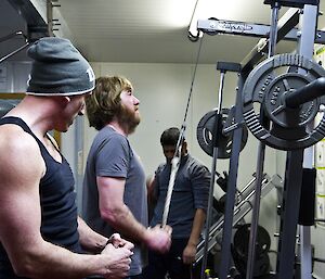 Lee instructing Tim on a exercise machine