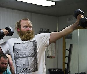 Matty showing off with weights posing like Bolt