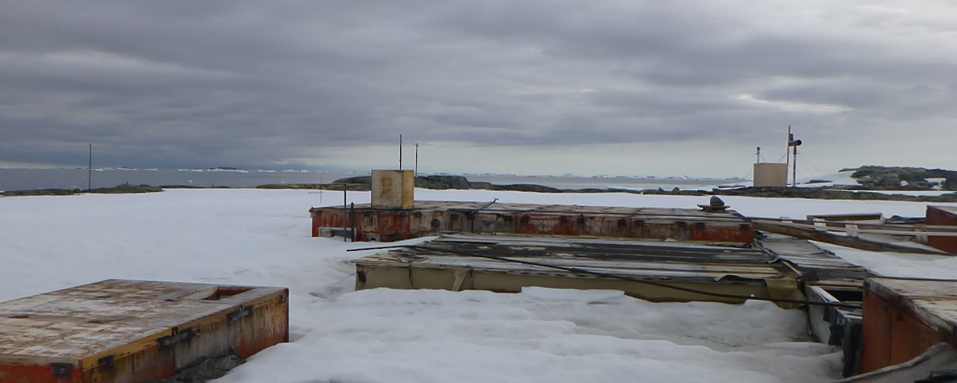 Nearly fully cover old station buildings, only parts of the roofs exposed