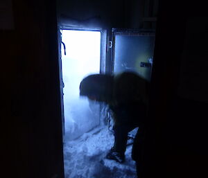 Mark digging the snow out of the hut door way