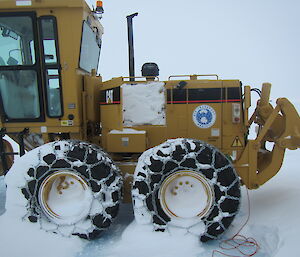 The Wilkins aerodrome grader with the hatch open before digging out the snow.