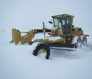 Snow covered grader