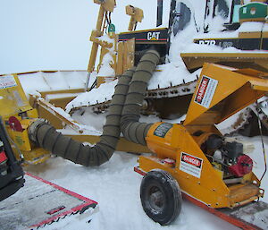Large heaters melting the snow inside the dozer