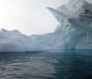 Icebergs with water in the foreground