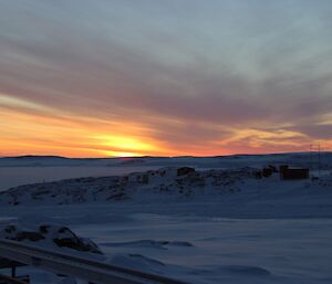 Morning sunrise with reflections off high cirrus clouds refracting different sunrise colours