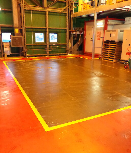 Freshly painted red pathways in a storage warehouse
