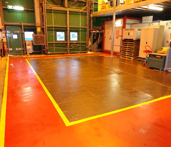Freshly painted red pathways in a storage warehouse