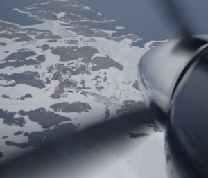 View of Casey out the window of a propeller aircraft
