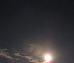 Bright large Moon with the night stars