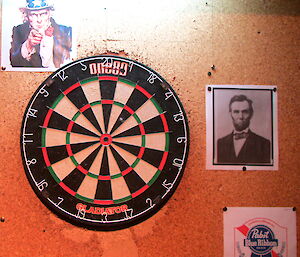 A number of American posters around the dart board