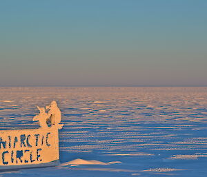 Snow cover Antarctic Circle sign