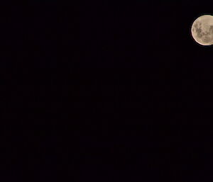 Night shot of the supermoon in the right hand corner