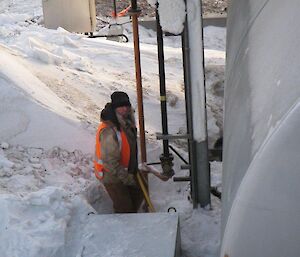 Mark clearing some snow under the fuel farm