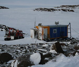 Browning Hut in a snowy and rocky terrain