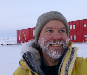 A self portrait of Jukka outside with his beard covered in snow.