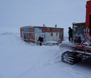 Expeditioners unloading equipment and supplies from the Hagg to the Hut