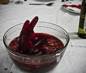 Red punch with a red ice shaped like a hand