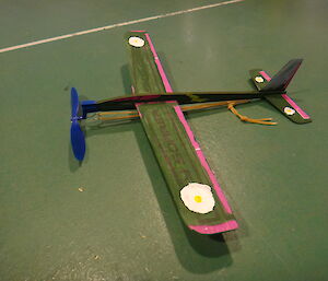 A green painted toy plane