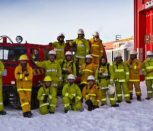 Fire team group picture with the red fire Hagg in the background