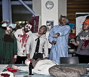 A group picture in the mess with everyone in a zombie outfit