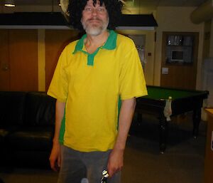 Jukka dressed in green and gold
