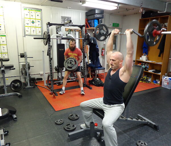 Mick and Lee working lifting weights