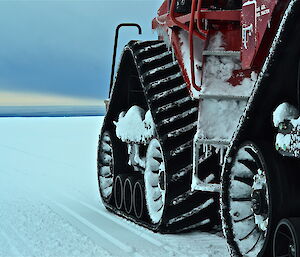 Wheels of the Quad Track on the flat snow terrain