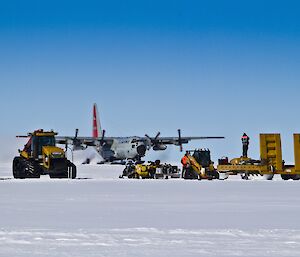 Hercules taxi-ing with machinery and transport on the foreground