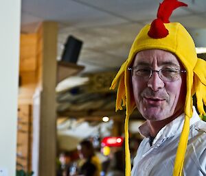 Paul wearing a rooster hat