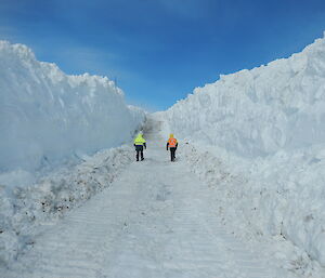 A wall of snow and ice of both side of a newly groomed road to the Wharf