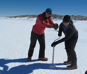 Tracey and Billy measuring the sea ice thickness in Shirley Island channel