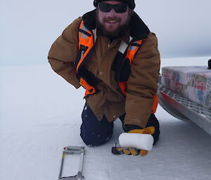 Blair holding a fine example of an ice core.