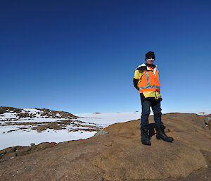 Doug watching the whales attention wearing high visibility orange top