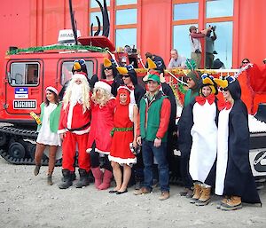 A group of festively dressed expeditioners during Christmas celebrations