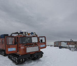 A Hägglunds vehicle parked in front of the Wilkes Hilton