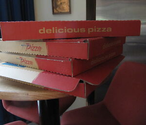 Pile of commercial pizza boxes