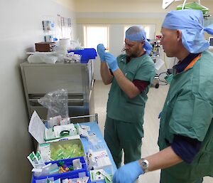 Ian Coleman and Steve Black practising medical skills at Casey Station, in this case administering medications