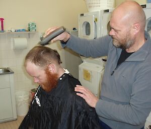 An expedition gets a haircut, at Casey station, Antarctica