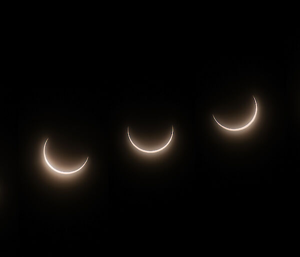 A sequence of images that show the progressive movement of the moon in front of the sun during a solar eclipse witnessed at Casey as a partial solar eclipse.