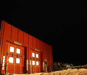 The emergency vehicle shelter at night, a square metal building