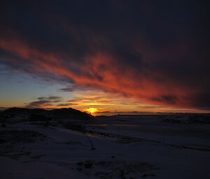 The sun sinking below the horizon at Casey