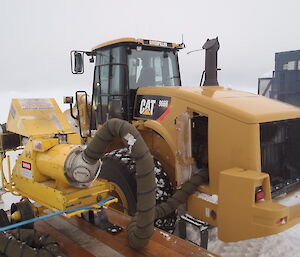 Heating the engine bay of a loader with a hot air blower