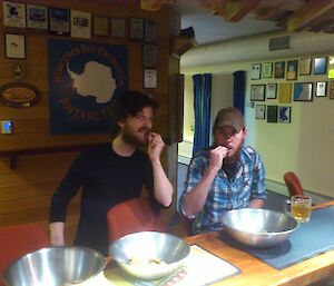 Expeditioners tasting some home made beef jerky at the bar.