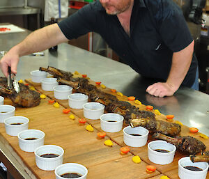 Rob Bennett serving up steak in the kitchen