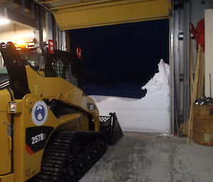 Skidsteer in the field store at Casey station, preparing to clear snow