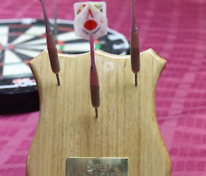 The wooden plaque/trophy made by Scott Clifford for the winner of the Casey darts tournament