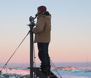 Steve Black at Casey collecting the paper burn strip from the Campbell-Stokes sunshine recorder
