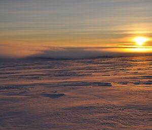 A thick fog rolling in at sunset, Wilkes Hilton hut near Casey