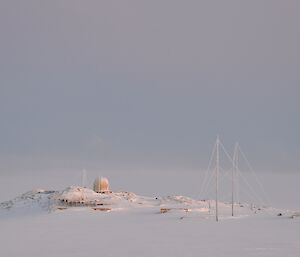 Old communications antenna covered in ice at the old Wilkes Station