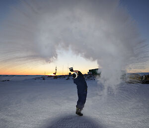 Steve McInnerney makes clouds with by throwing a cup of boiling water into the air